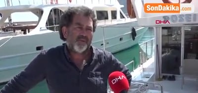 Osman Cengiz interviewed by DHA on the quay in front of Poseidon 07